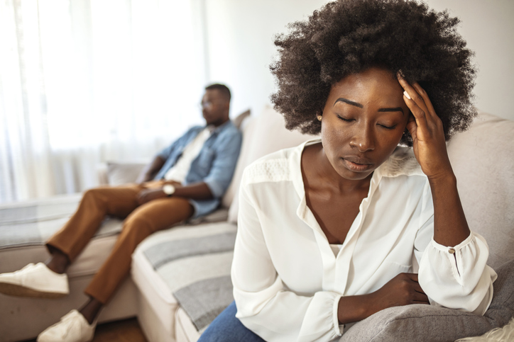 black woman on couch with husband
