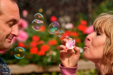 Woman blowing bubbles