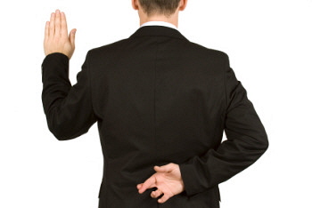 Man standing with his left hand raised