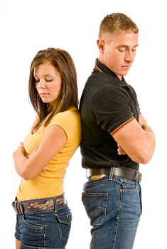 Couple standing back-to-back